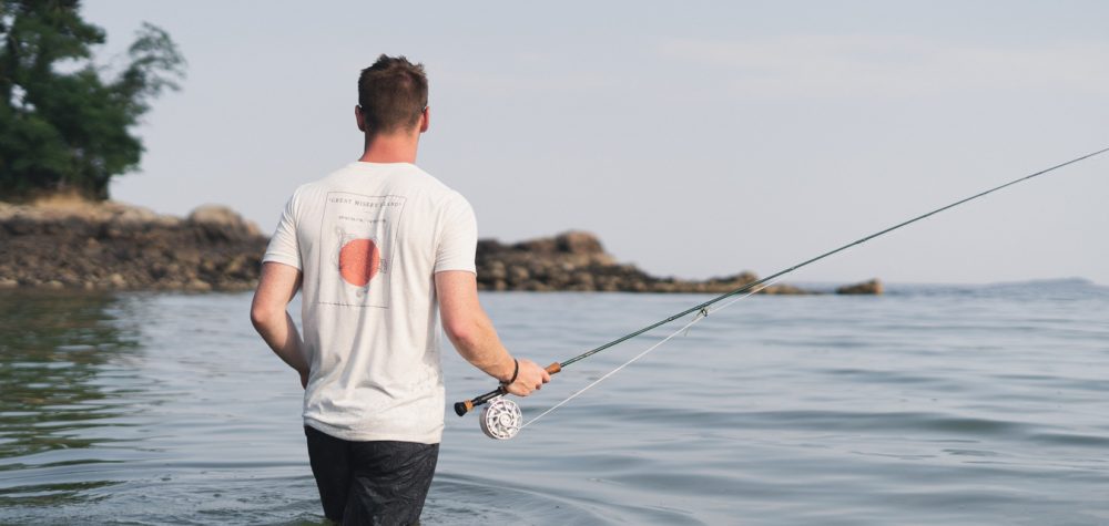Man Fishing on Boston's North Shore Wearing Capefish Great Misery T Shirt